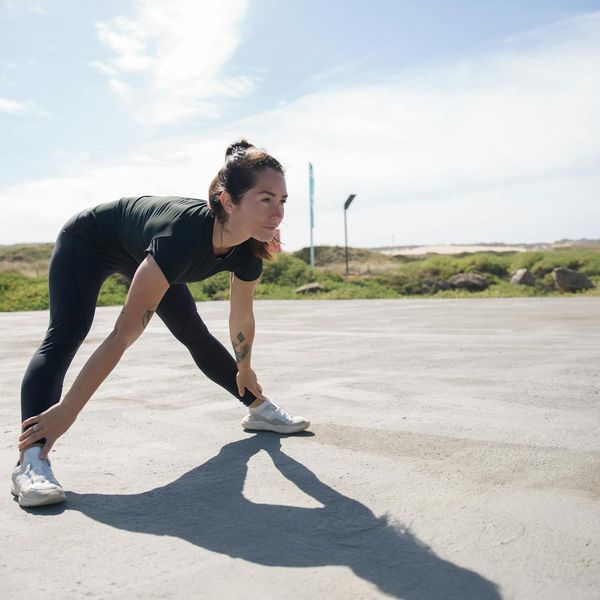 Person feeling energized and stretching after a light workout.